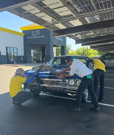 Lux Wash and Detail team cleaning a classic car in Elk Grove