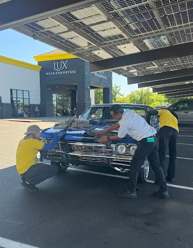 Lux Wash and Detail team cleaning a classic car in Elk Grove