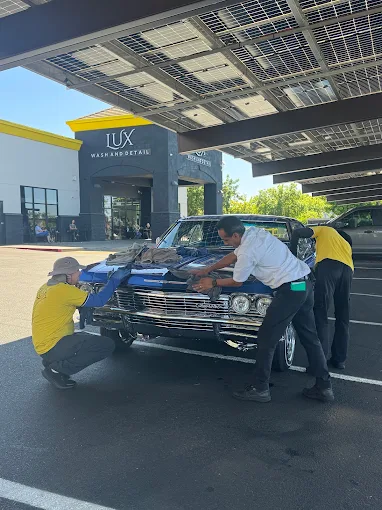 Lux Wash and Detail team cleaning a classic car in Elk Grove
