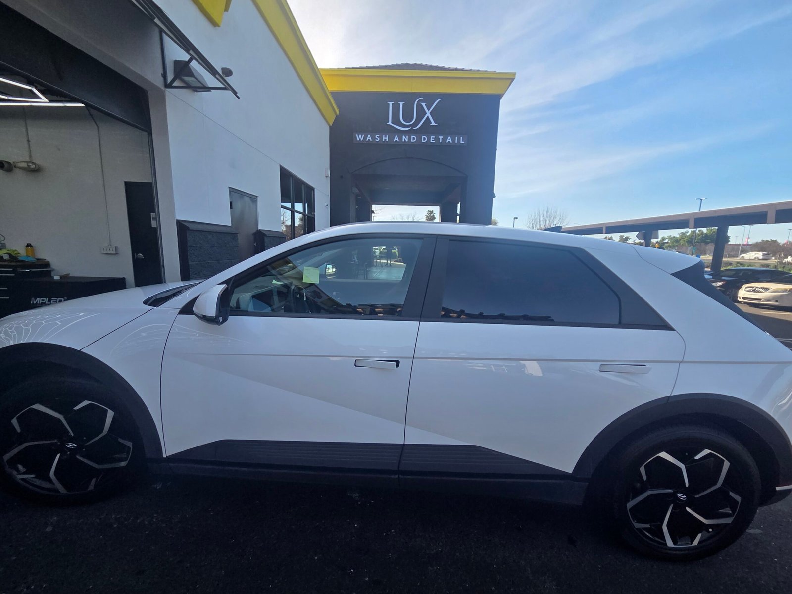 Lux Wash and Detail team caring for a vehicle in Elk Grove